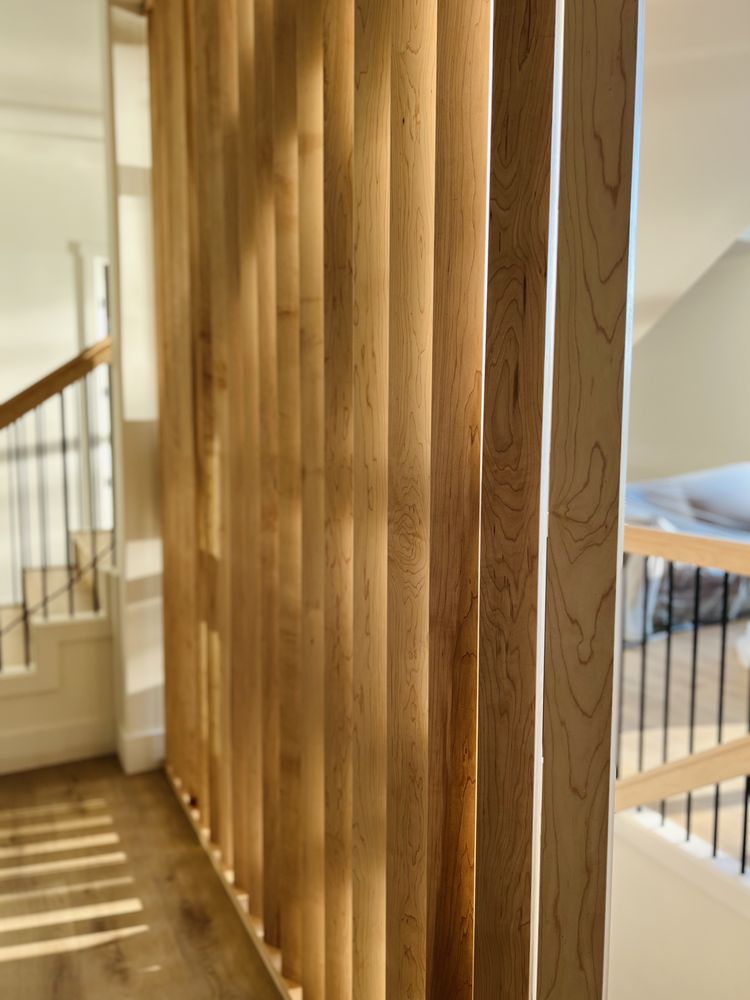 Maple slat wall in warm sunlight